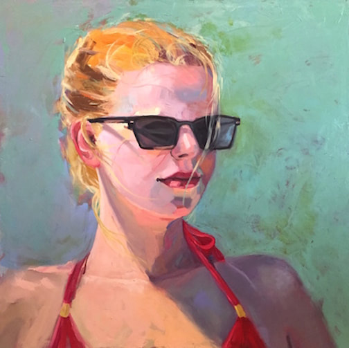 Portrait of a young white woman with blonde hair in sunglasses a red bathing suit.