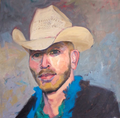 Portrait of a white man with a blonde beard in a cowboy hat