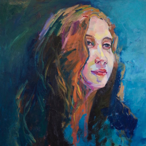 Portrait of a young red haired white woman on a blue background