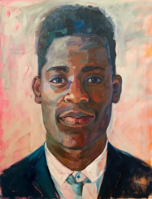 Portrait of a young black man in a suit and tie.