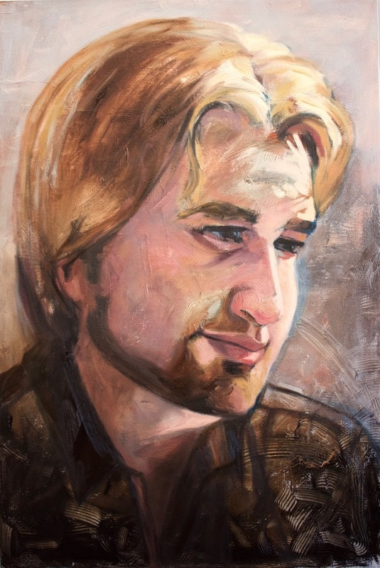 Portrait of a blonde man with a beard and an 80's hairdo.